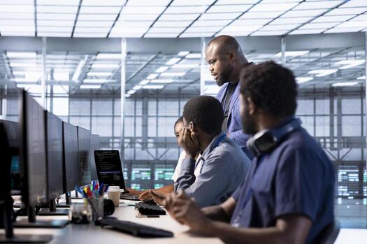 Team of data center office system administrators using programming languages to construct algorithms and build applications. African american server farm IT professionals debugging and optimizing code photo