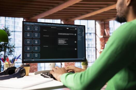 Man solving personal tasks with AI LLM chatbot answering prompts using predictive technology. Person using computer in apartment to interact with large language model program photo