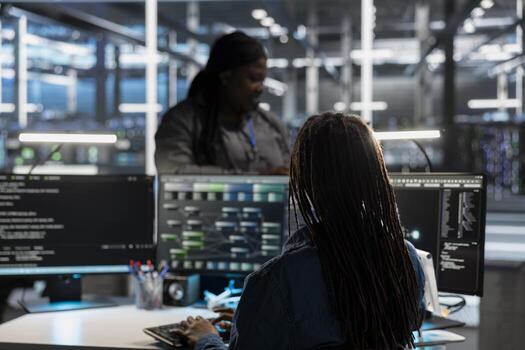 Data center system administrator using artificial intelligence neural networks tech and node trees. Server farm employee using AI programming language on computer, configuring specialized hardware photo