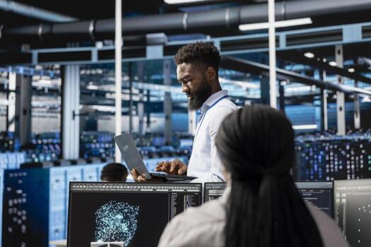 Data center engineer looking at AI visualization dashboard to pinpoint performance issues across server clusters. Server hub worker looks at data analysis graph to reduce hardware failures photo