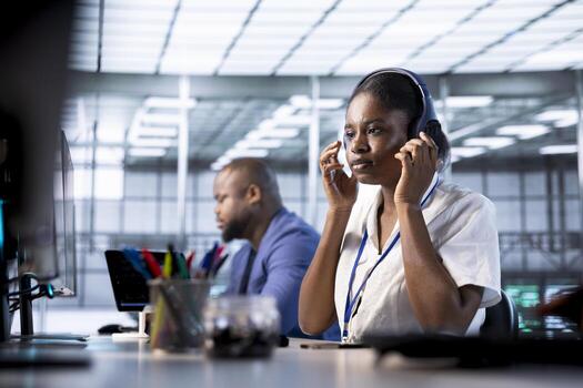 Programmer reconfiguring neural networks server hub to optimize it for data processing requirements. Deep learning IT specialist ensuring data center workspace operates efficiently photo