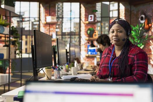 Portrait of call center agent using AI chatbot to provide quick and accurate replies to common customer queries. Customer service representative generating automated responses to clients using AI photo