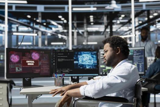 Engineer with paraplegia upset after seeing errors while overseeing data center machines processing workloads. Perplexed worker with disability struggling with fixing glitches while doing maintenance on server rigs photo
