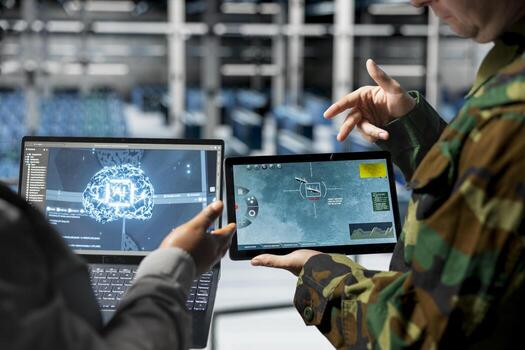 Team of army workers in data center mapping airborne activity using predictive AI tech on devices. Military units in server room flagging unusual movement using deep learning detection tools on tablet photo