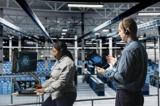 Server hub engineers providing remote tech support using headset and artificial intelligent tools. Teamworking employees coordinating IT maintenance tasks using AI technology photo