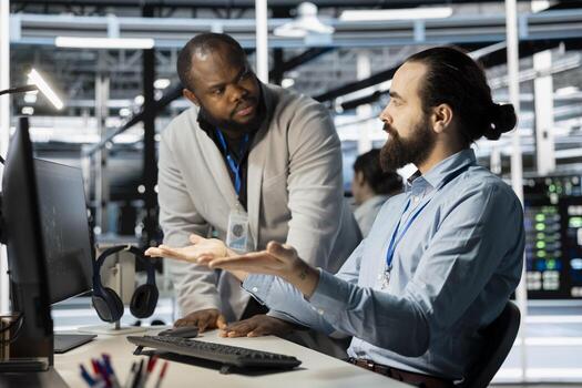 Data center engineering team working together to verify neural network parameters. Server hub teamworking colleagues inspecting configurations to ensure optimal performance photo