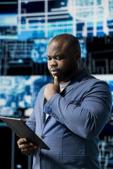 Black smart IT engineer examining artificial intelligence brain systems using cloud computing tools and advanced programming. Using machine learning for virtual assistant automation. photo