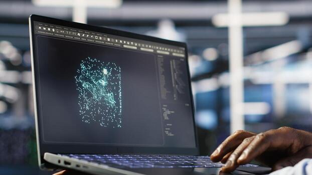 Close up of data center admin using machine learning algorithms on laptop to analyze large datasets. Server farm worker using artificial intelligence on notebook to recognize data patterns, camera B photo
