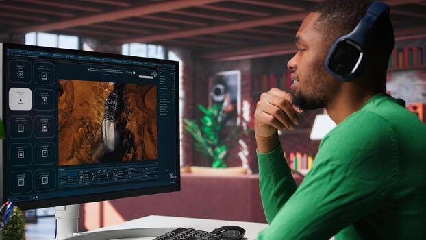 Computer screen displays digital visuals generated through AI. Young person uses software combining data and machine learning, text prompts to design graphics at home office. Camera B. photo