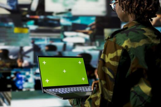 Close up of air defense expert using radar systems on isolated screen laptop to detect incoming ballistic missiles. Military soldier scanning rockets approaching borders using mockup notebook photo