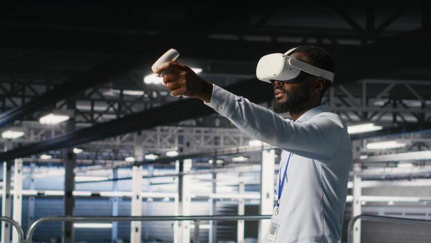 Engineer using VR headset in data center to update server tech, configuring equipment using software tools. Server hub employee reviewing hardware analytics using virtual reality photo