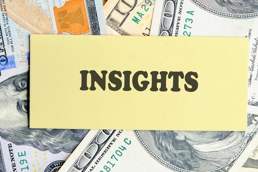 INSIGHTS written on yellow paper on the background of banknotes. Technology and data science concept. photo