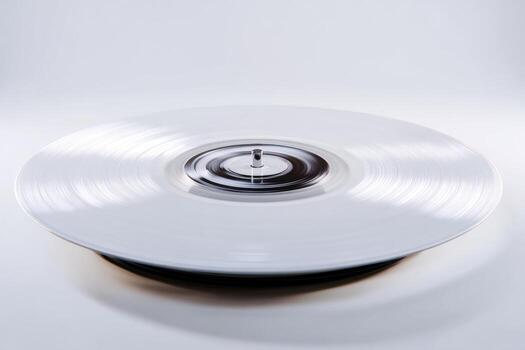 Vinyl record spinning to produce calming light frequencies in a serene setting photo