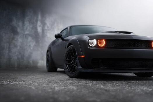 Sleek black muscle car in urban setting with moody background at dusk photo
