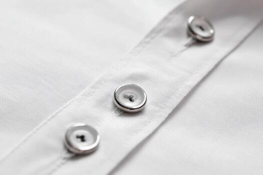 Close-up view of a shirt placket featuring contrasting buttons and fabric texture photo