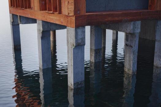 House foundation floating on water captured at dusk for architectural study photo