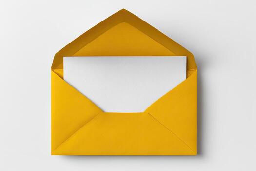 A bright yellow open envelope with a white blank sheet inside, set against a white backdrop photo