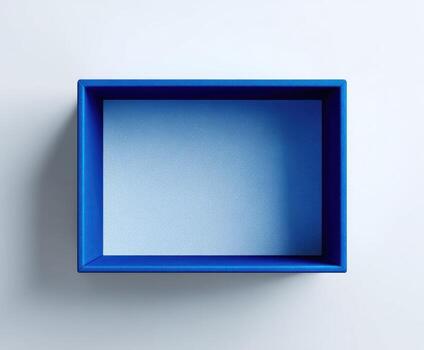 Square, open, blue box on a white wall. Simple, modern, top-down view. Shadow present photo