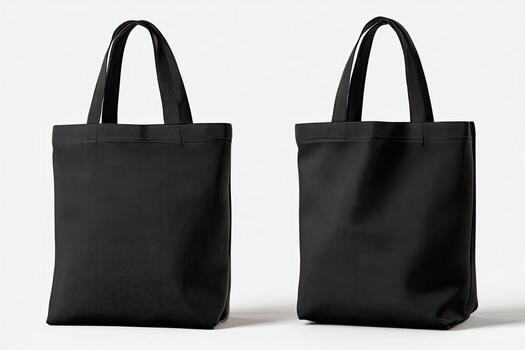 Two black tote bags on white background. Each has handles and a simple, rectangular shape photo