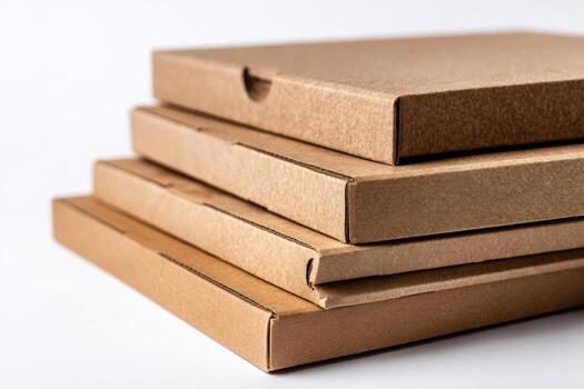 Close-up of stacked cardboard boxes, each with a rectangular shape, against a white background photo