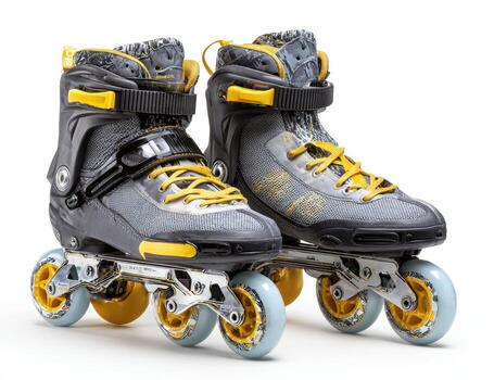 Two inline skates featuring a gray and yellow color scheme, with a white background photo