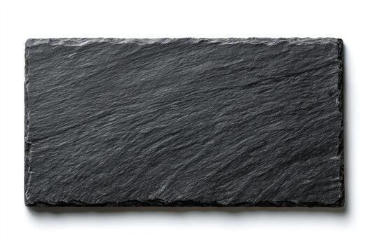 Rectangular, textured, dark grey serving platter on a white surface, with visible shadows photo