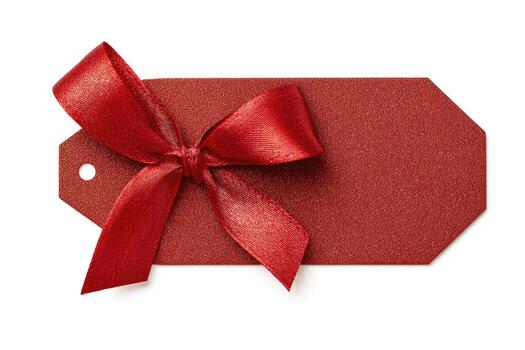 Red gift tag with a matching satin bow tied on top. Isolated on white photo