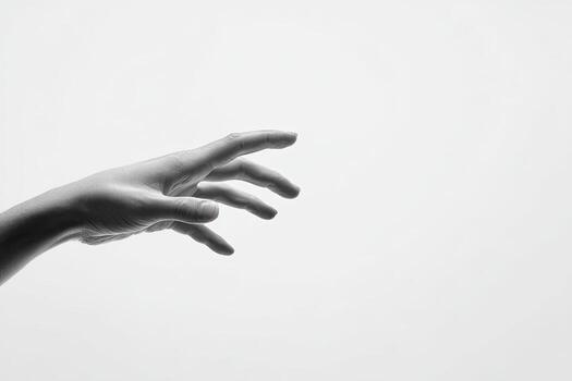 A grayscale image of a hand extending towards the upper right, against a white background photo