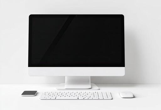 A clean, white desktop computer setup with accessories, facing the camera photo