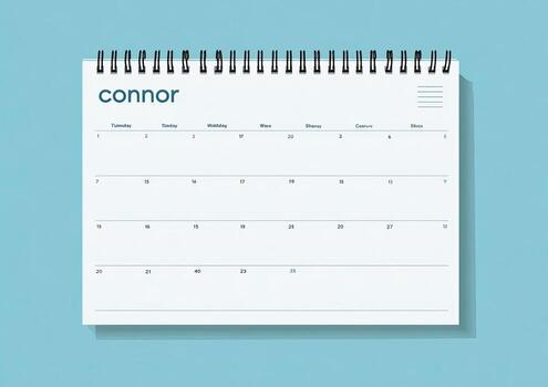 A simple spiral-bound calendar page against a blue backdrop, showing the days and dates photo