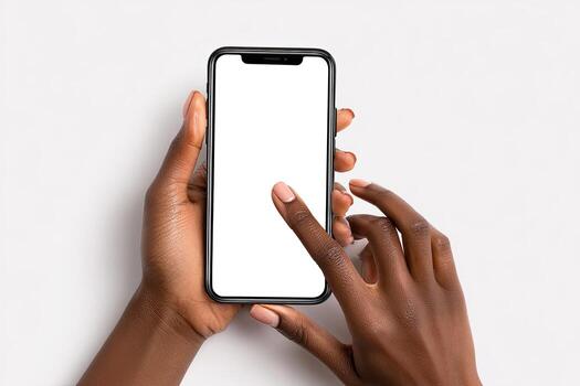 Hands holding a phone with blank screen against a white backdrop, ready for use photo