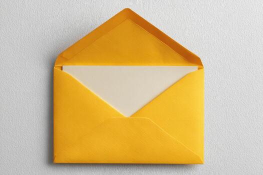 A bright yellow envelope, slightly open, with a white card inside, set against a neutral backdrop photo