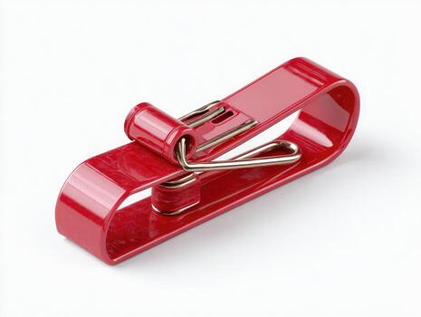 A glossy red metal clip with a silver wire clasp, isolated on a white background photo