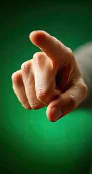 Close-up of a hand pointing directly forward photo