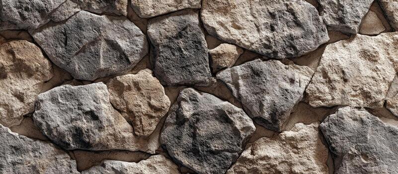 un de cerca ver de un texturizado Roca muro, presentando irregularmente conformado gris y beige rocas foto
