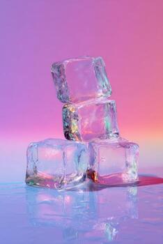 Four clear ice cubes stacked, reflecting multicolored light against a gradient background photo