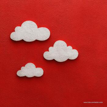 Three fluffy, white clouds against a vibrant red textured background, minimalist and cheerful photo