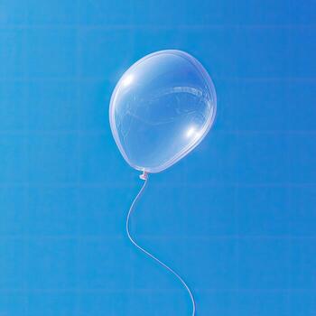 A translucent balloon tied with string floats against a vivid, cloudless, light blue sky photo