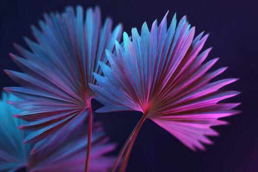Vivid, neon-lit palm leaves in pink and blue against a dark backdrop, creating a vibrant display photo