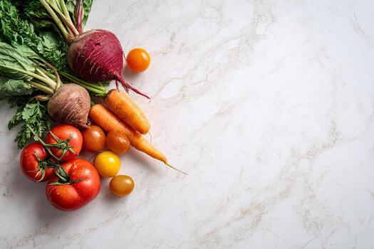 Assortment of fresh produce, including beets, carrots, and tomatoes, on a marble surface photo