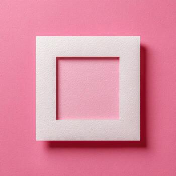 Square, white paper picture frame on a textured pink background. High-angle view, studio photo