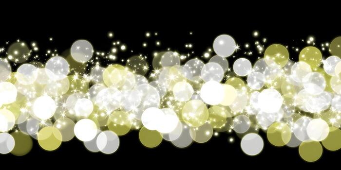 A vibrant horizontal bokeh border with golden and white sparkling lights on a dark background creating a festive and elegant illumination photo