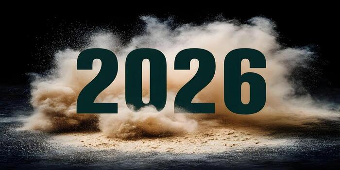 The year 2026 is shown dynamically with dust exploding on a dark background photo