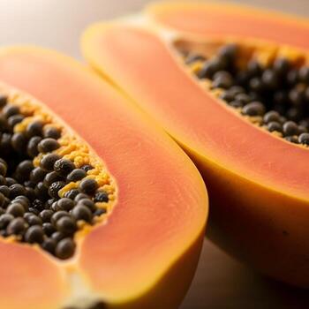 Macro close-up reveals succulent, perfectly ripe papayas with intricate textures, soft gradients and vibrant hues against an elegant minimalist backdrop. photo