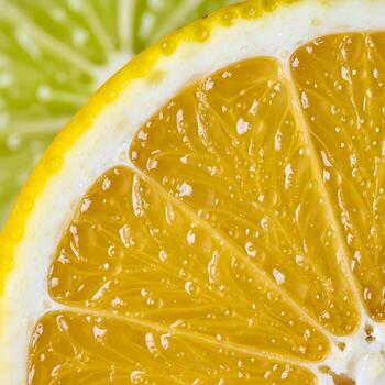 Vivid Citrus Explorations A Macro Close-Up Displaying the Iridescent Beauty of Luminous Fresh Juice Droplets and Intricately Textured Zesty Slices photo