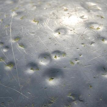 Intricate Macro Study of Weathered Zinc Surface Revealing Subtle Shimmering Highlights, Delicate Textures, and Timeless Industrial Elegance that Exudes Character photo