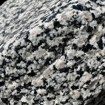 Granite Odyssey A Macro Exploration Revealing Rugged Texture, Intricate Grain Patterns, and Subtle Color Nuances Illuminated by Gentle Natural Light photo