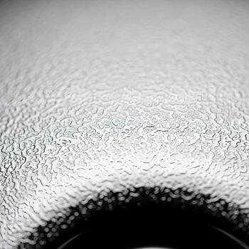 Macro Focus on Intricate Chrome Ultra Smooth Patterns Capturing Refined Ambient Light and Detailed Mood for an Upscale Impact photo