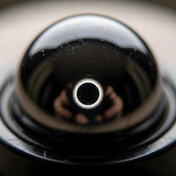 Celestial Mirage A Macro Exploration of Reflective Surfaces Unveiling a Miniature Eclipse with Subtle Illumination, Exquisite Textures, and Harmonized Contrast photo