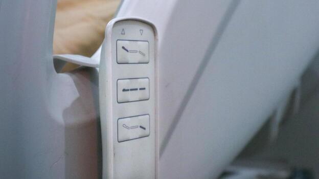 Remote control for adjustable bed with buttons for elevation and position settings photo